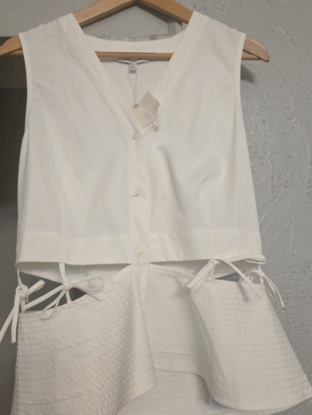 White Sleeveless Button V-Neck Peplum Top